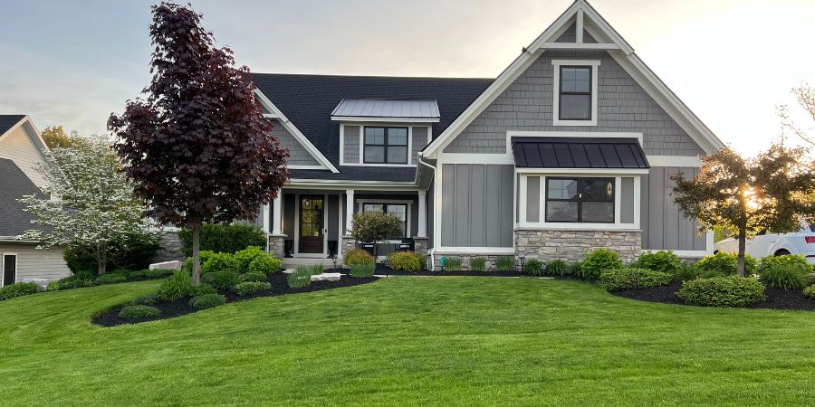 green grass with house and landscaping