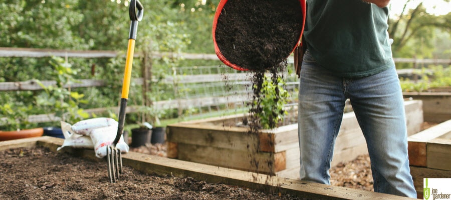 Adding compost to a garden