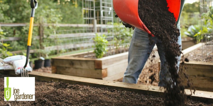 adding compost to garden