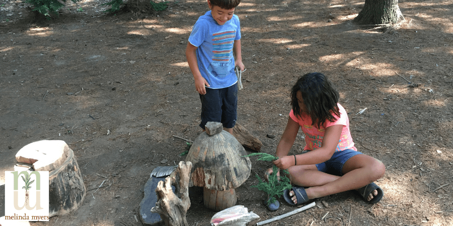 kids builiding a fairy garden