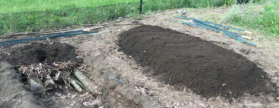 Adding soil to the top of your Hugelkultur garden