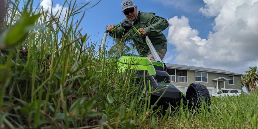 Allyn Hane mowing the lawn