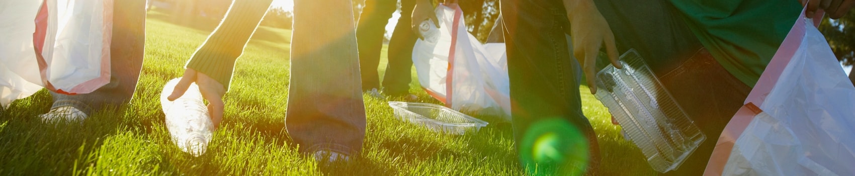 Cleaning up trash in the lawn.