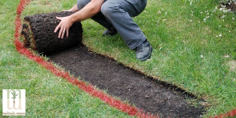 man removing grass and sod